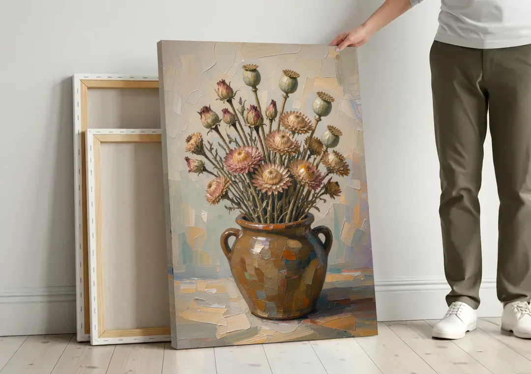 Dried Flower Painting with Poppy Pods in a Crock canvas wall art leaning against a wall next to blank canvases