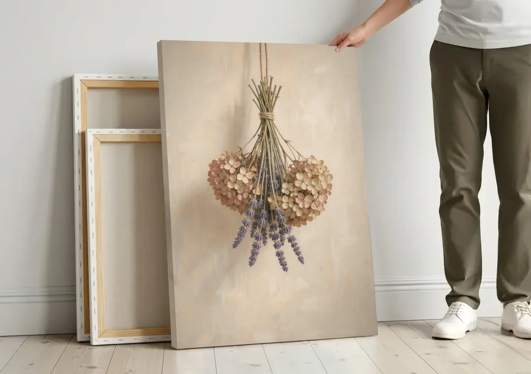 Dried Flowers Wall Art of Hydrangea and Lavender canvas wall art leaning against a wall next to blank canvases