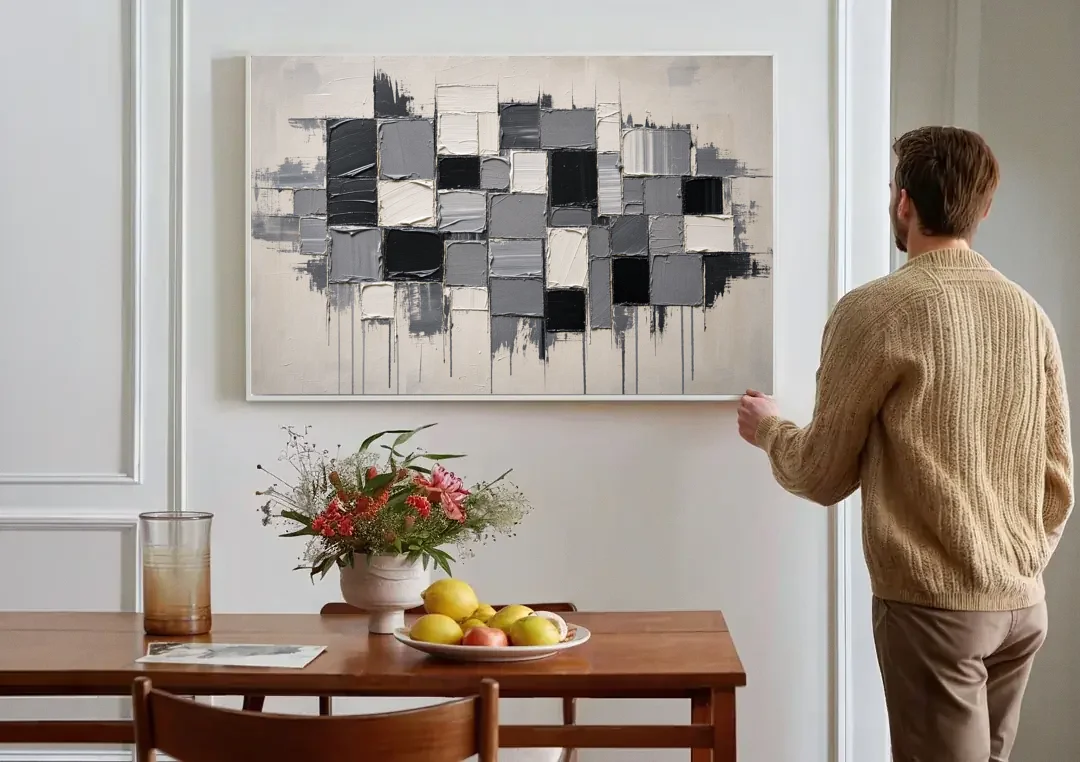 Dripping Grid of Black and Grey Squares canvas wall art above a dining table