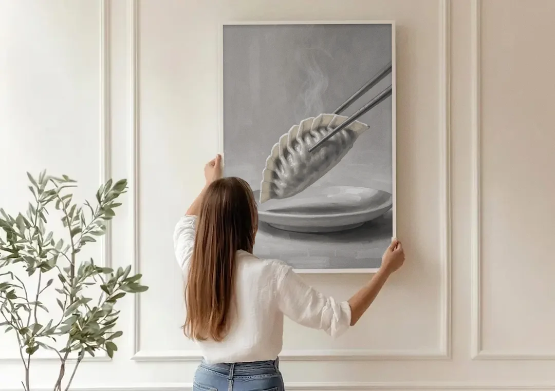 Dumpling Painting with Chopsticks and Steam canvas wall art being hung on a paneled wall