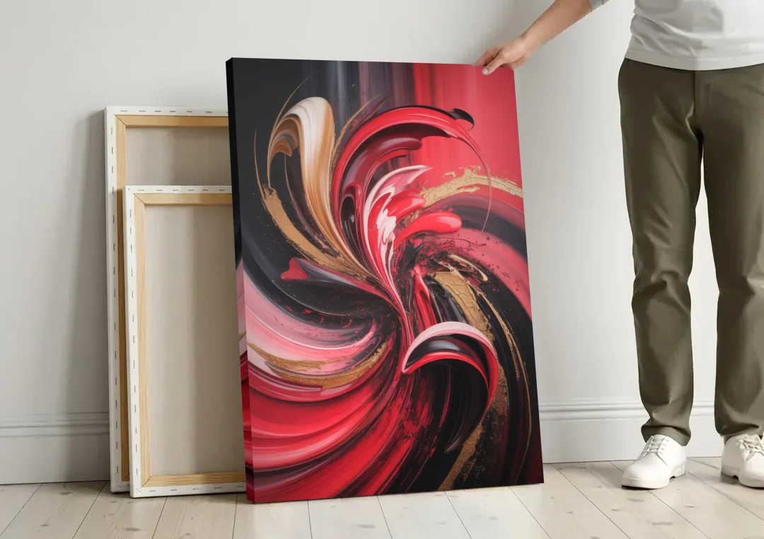 Dynamic Swirl Red Abstract canvas wall art leaning against a wall next to blank canvases