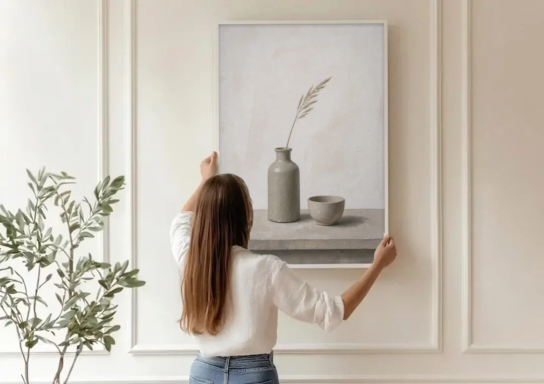 Earth Tone Wall Art with Stoneware Bottle and Cup canvas wall art being hung on a paneled wall