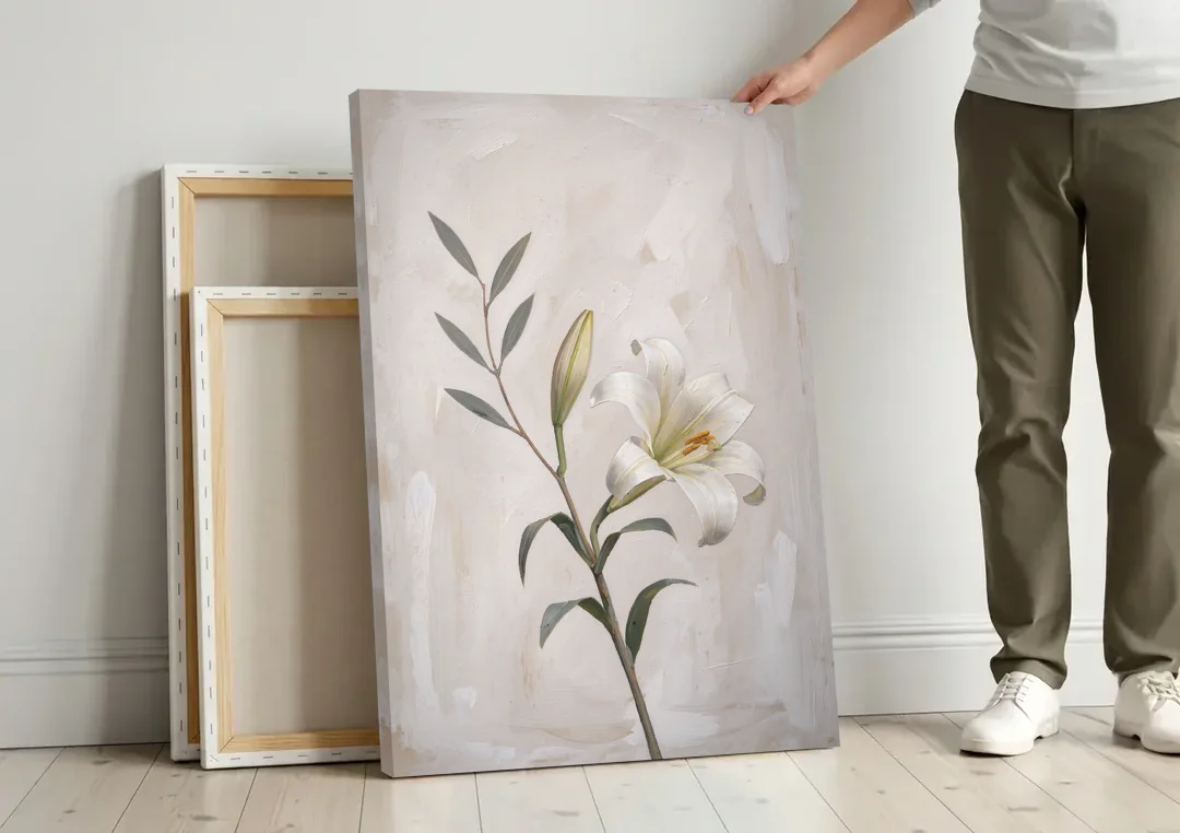 Easter Wall Decor with a Single White Lily canvas wall art leaning against a wall next to blank canvases