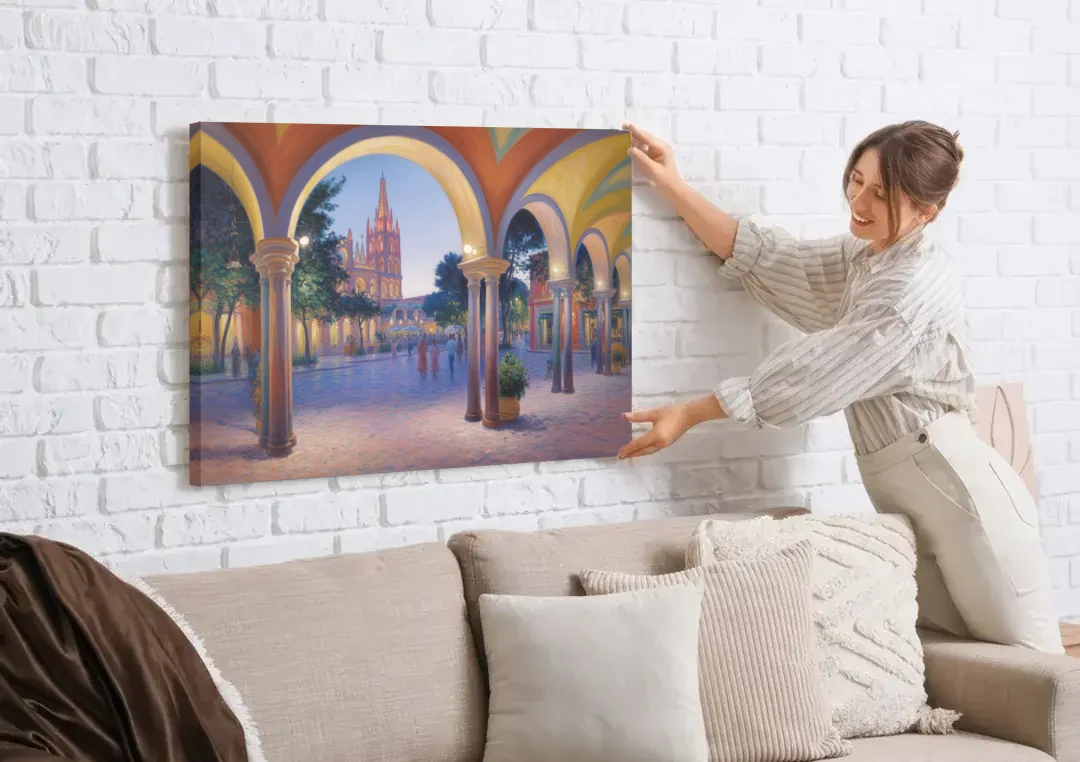 El Jardín Evening canvas wall art being hung on a white brick wall above a sofa