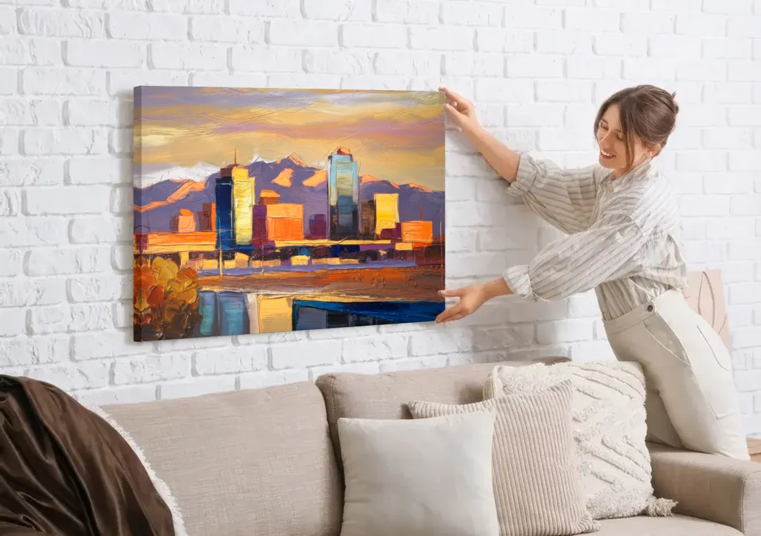 El Paso Skyline View canvas wall art being hung on a white brick wall above a sofa
