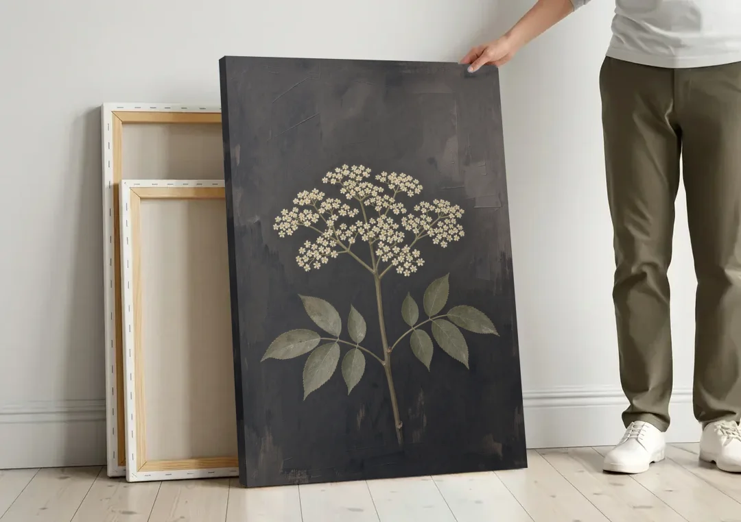 Elderflower Painting on a Dark Field canvas wall art leaning against a wall next to blank canvases