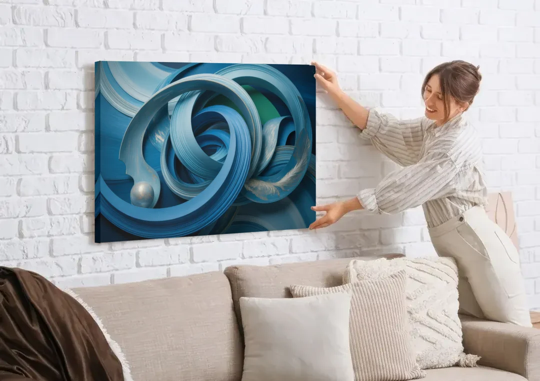 Elegant Fluidity in Blue Abstract canvas wall art being hung on a white brick wall above a sofa