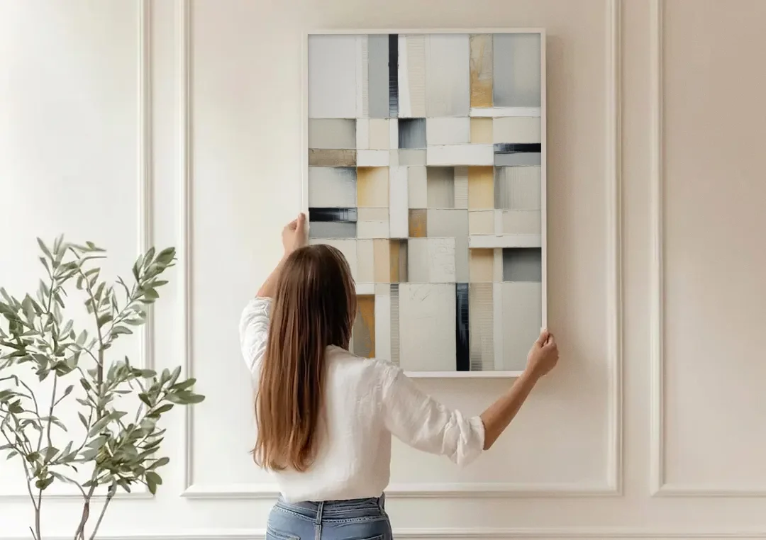 Elegant Geometric Intersections White Abstract canvas wall art being hung on a paneled wall