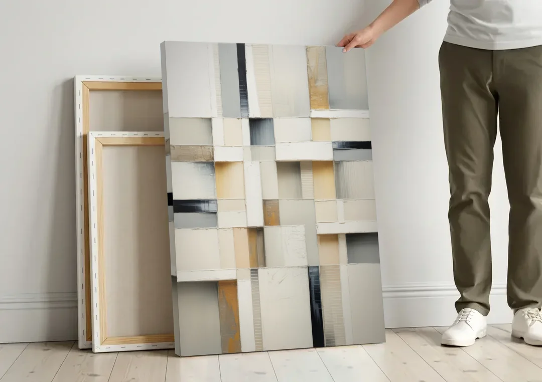Elegant Geometric Intersections White Abstract canvas wall art leaning against a wall next to blank canvases