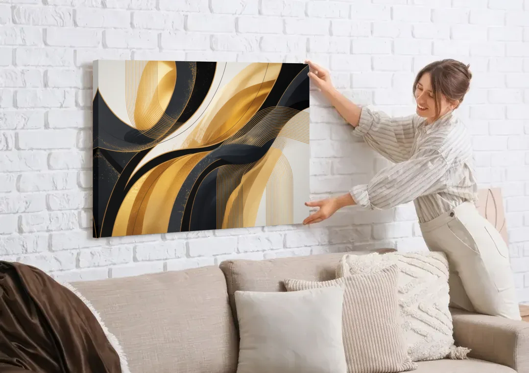 Elegant Geometry Black and Gold Abstract canvas wall art being hung on a white brick wall above a sofa