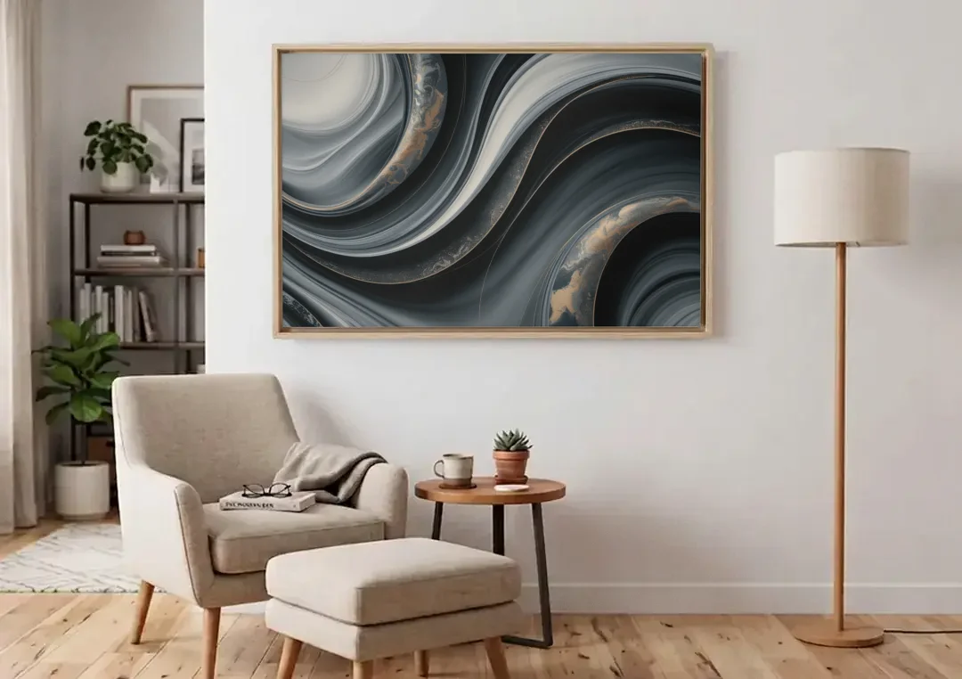 Elegant Ripples Black and Grey Abstract canvas wall art above an armchair in a bright living room