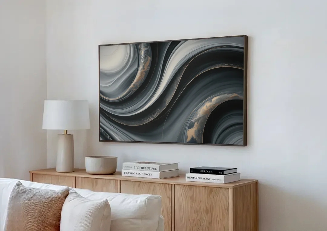 Elegant Ripples Black and Grey Abstract canvas wall art above a wooden sideboard next to a sofa