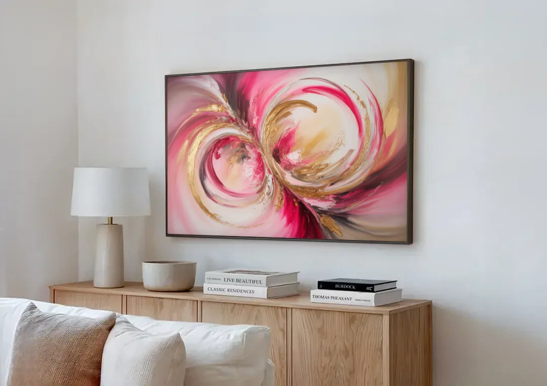 Elegant Swirl Pink and Gold Abstract canvas wall art above a wooden sideboard next to a sofa