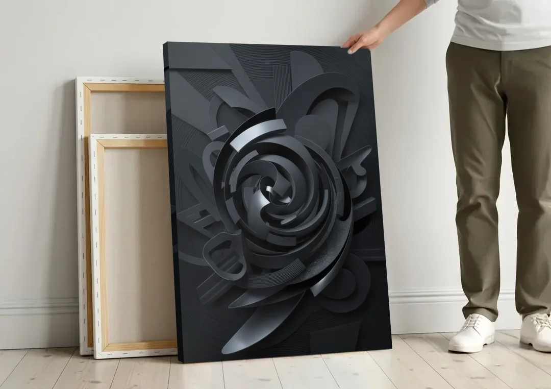 Elegant Vortex Swirl Black Abstract canvas wall art leaning against a wall next to blank canvases
