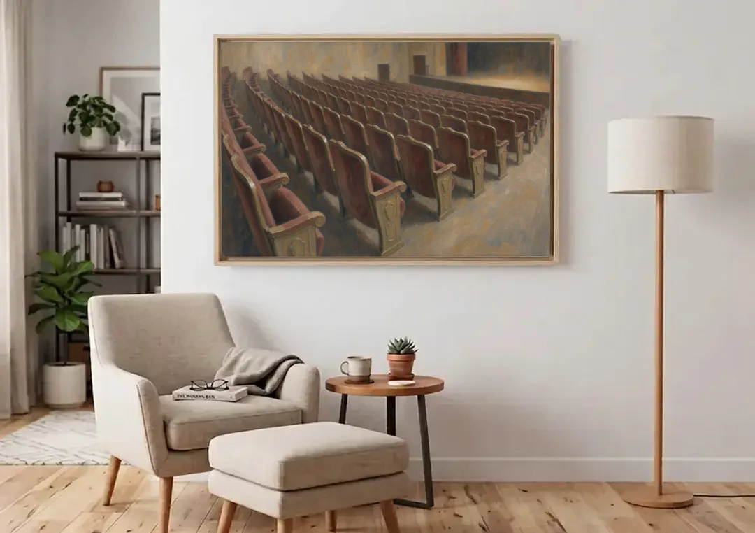 Empty Red Velvet Theater Seats in Soft Haze canvas wall art above an armchair in a bright living room
