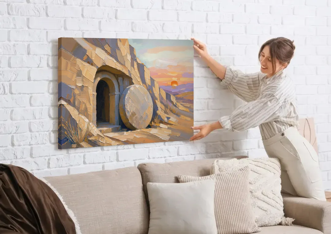 Empty Tomb Painting with Stone Rolled Away canvas wall art being hung on a white brick wall above a sofa
