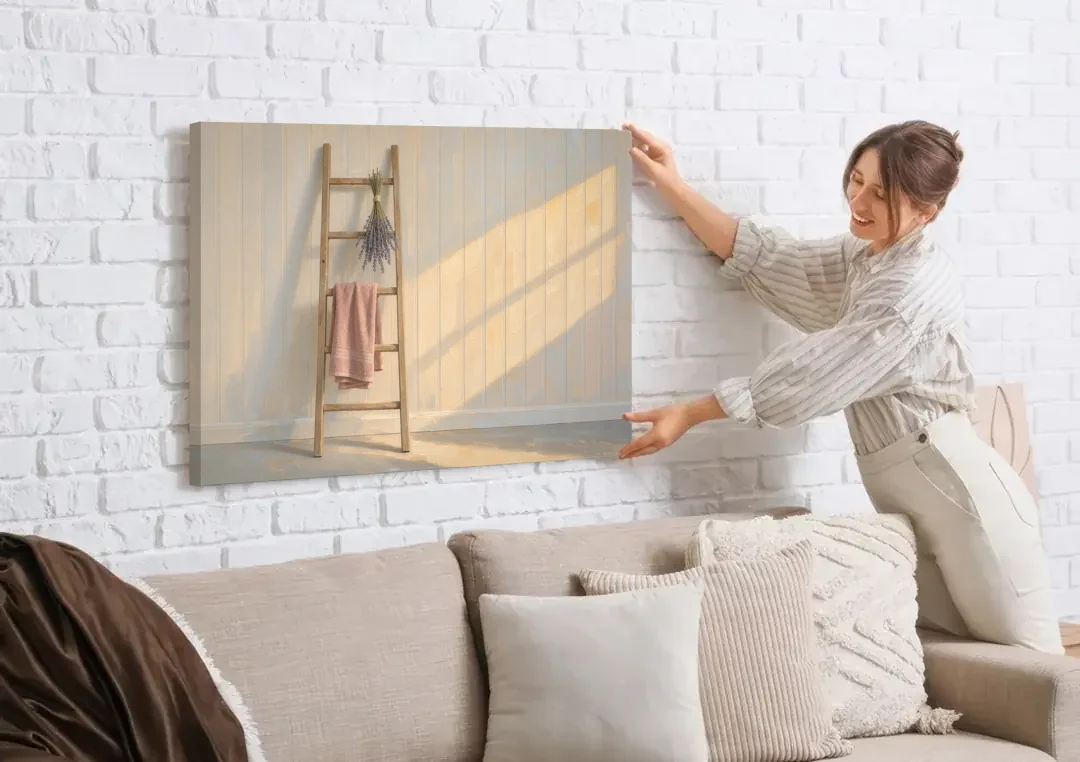 English Cottage Wall Art with Towel Ladder and Lavender canvas wall art being hung on a white brick wall above a sofa
