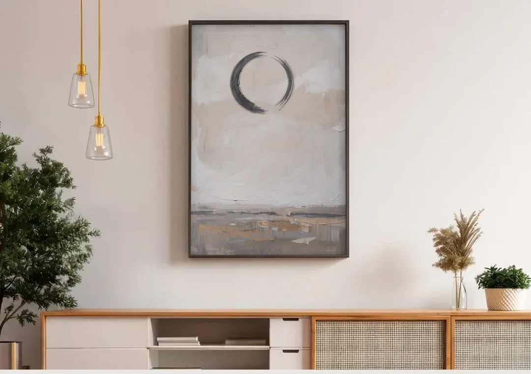 Enso Circle Painting Over Warm Sand canvas wall art above a wooden sideboard under pendant lights