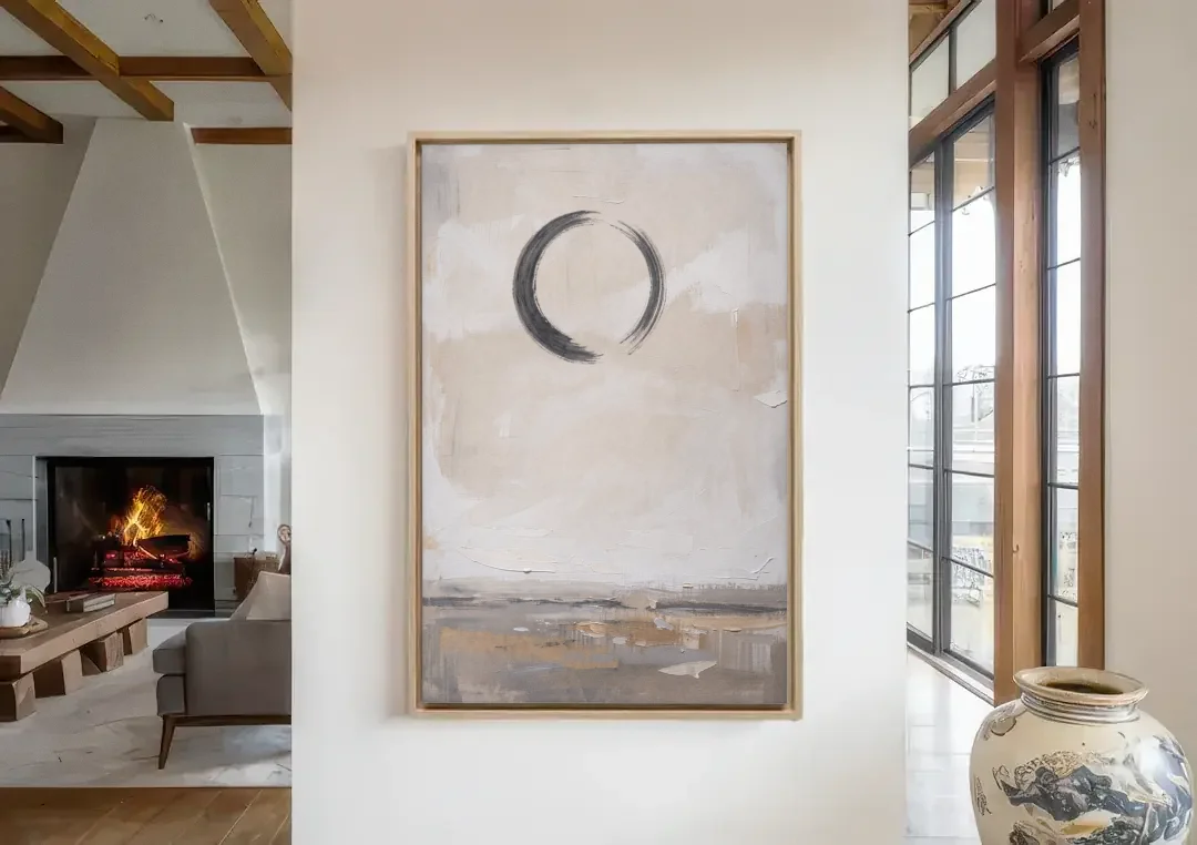 Enso Circle Painting Over Warm Sand canvas wall art in a living room with a fireplace
