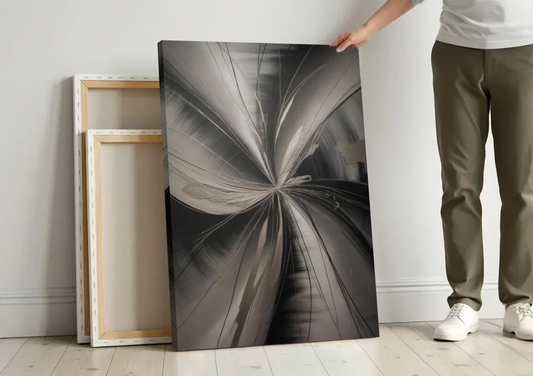 Entwined Elegance Black and Grey Abstract canvas wall art leaning against a wall next to blank canvases