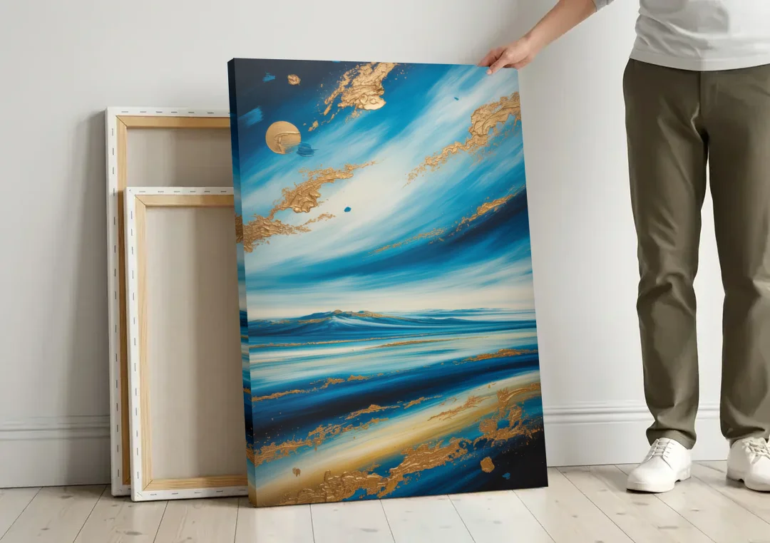 Eternal Horizon Blue and Gold Abstract canvas wall art leaning against a wall next to blank canvases