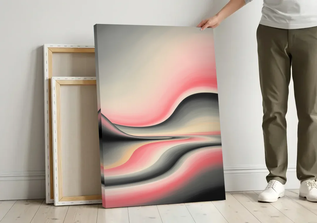 Ethereal Horizon Pink and Grey Abstract canvas wall art leaning against a wall next to blank canvases