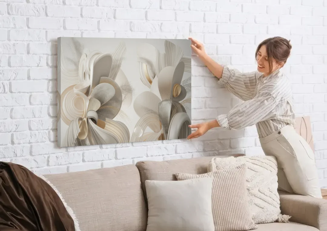 Ethereal Interplay White Abstract canvas wall art being hung on a white brick wall above a sofa
