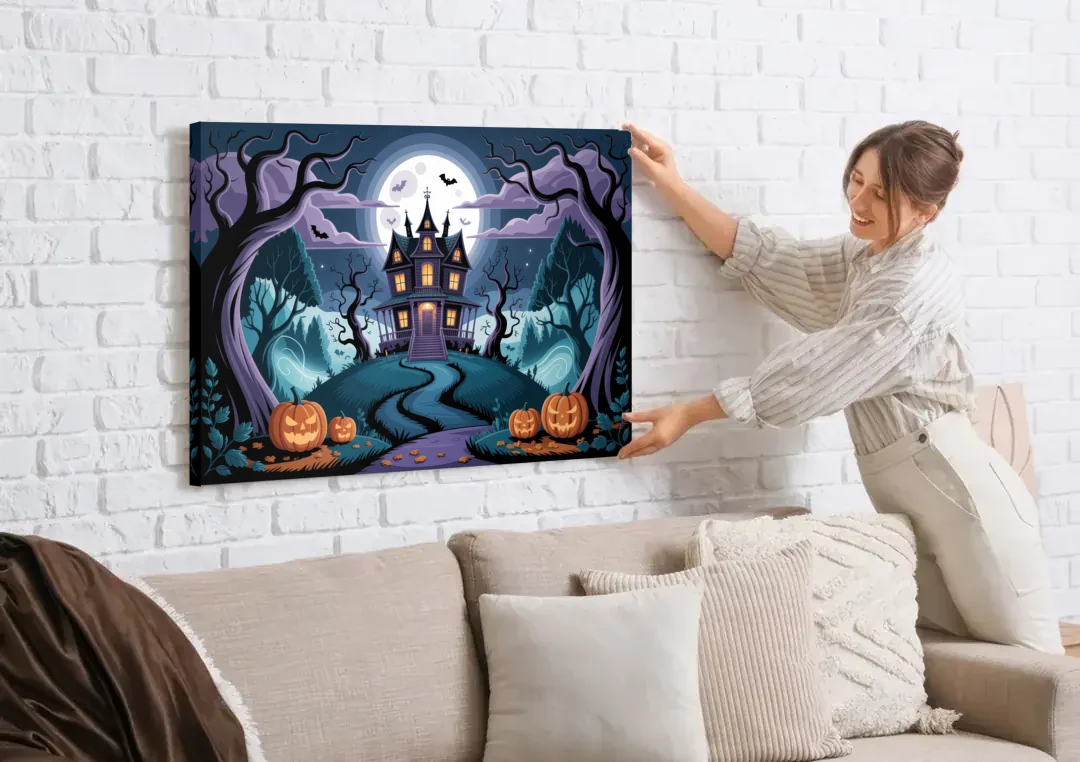 Ethereal Mansion Enchantment Halloween canvas wall art being hung on a white brick wall above a sofa
