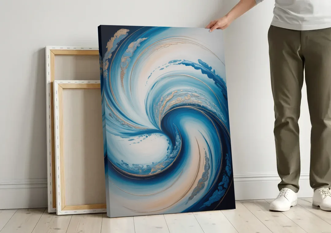 Ethereal Swirls in Blue Abstract canvas wall art leaning against a wall next to blank canvases