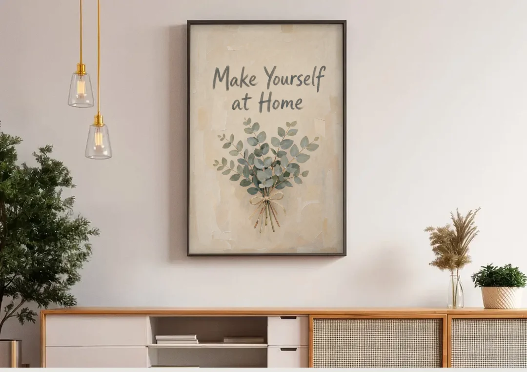 Eucalyptus Canvas Art Make Yourself at Home canvas wall art above a wooden sideboard under pendant lights