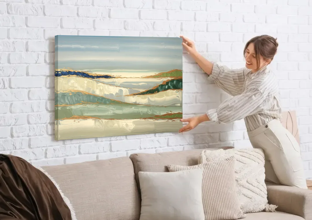Eugene Abstract Landscape canvas wall art being hung on a white brick wall above a sofa