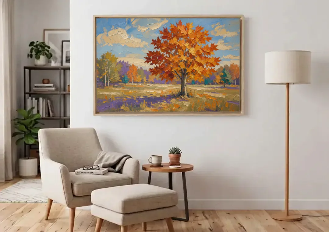 Fall Landscape Painting of a Blazing Maple canvas wall art above an armchair in a bright living room