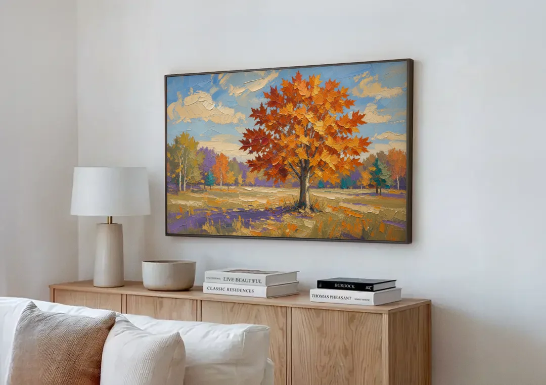 Fall Landscape Painting of a Blazing Maple canvas wall art above a wooden sideboard next to a sofa