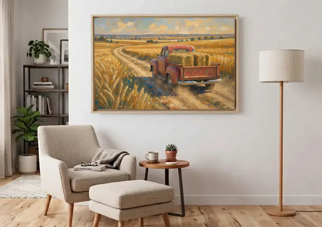 Farm Wall Art Hay Truck on the Wheat Road canvas wall art above an armchair in a bright living room