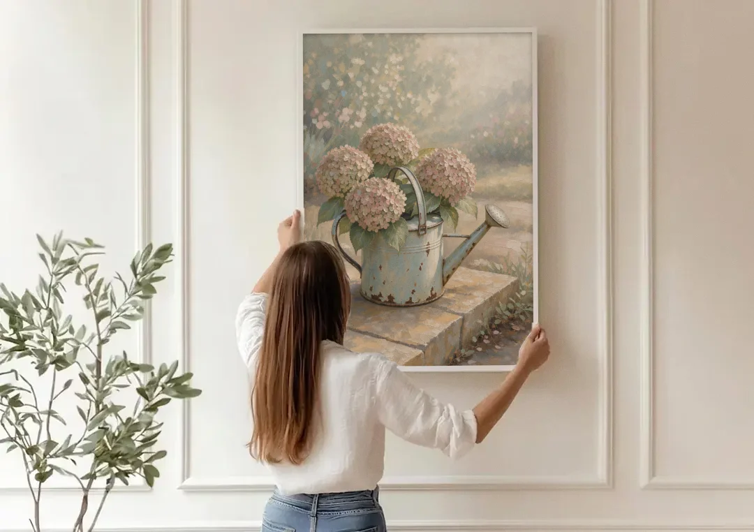Farmhouse Floral Wall Art with Hydrangea Watering Can canvas wall art being hung on a paneled wall
