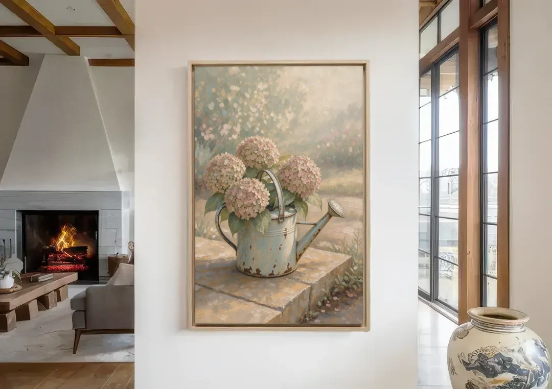 Farmhouse Floral Wall Art with Hydrangea Watering Can canvas wall art in a living room with a fireplace