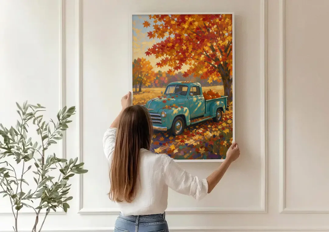 Farmhouse Truck Wall Art with Pumpkins Under Maple canvas wall art being hung on a paneled wall