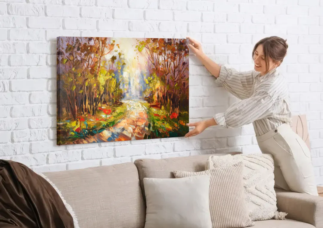 Fayetteville Nature Escape canvas wall art being hung on a white brick wall above a sofa