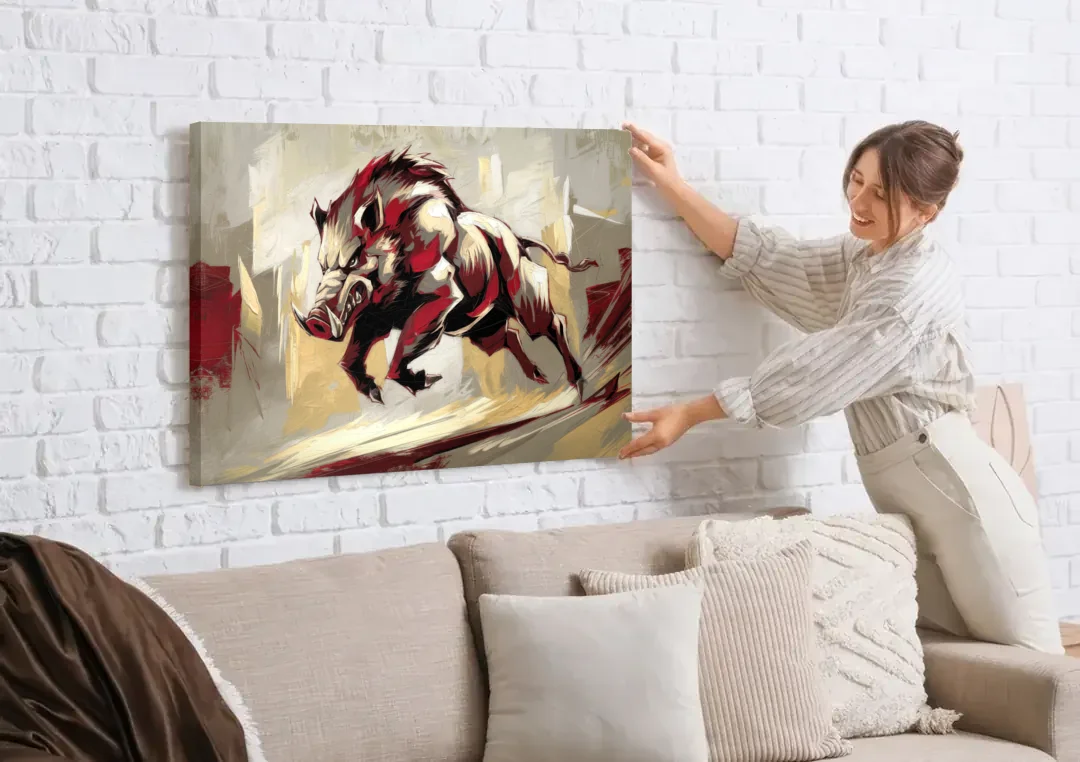 Arkansas Razorbacks Pride canvas wall art being hung on a white brick wall above a sofa