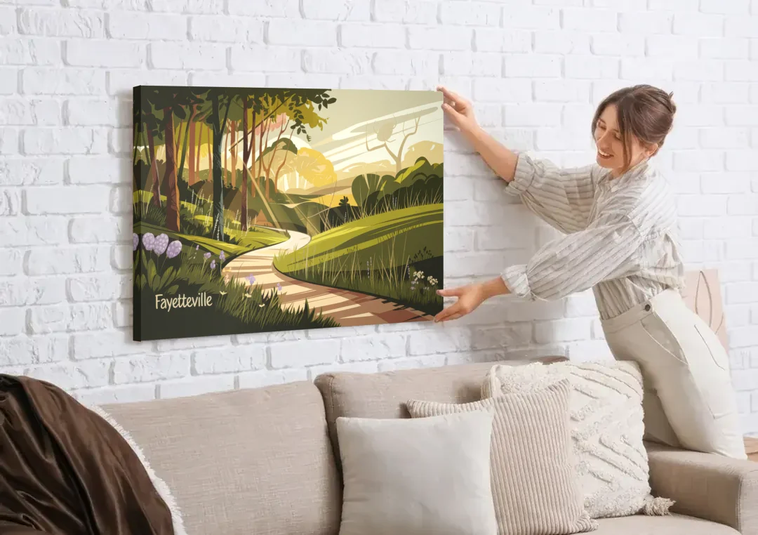 Fayetteville Scenic Trails canvas wall art being hung on a white brick wall above a sofa