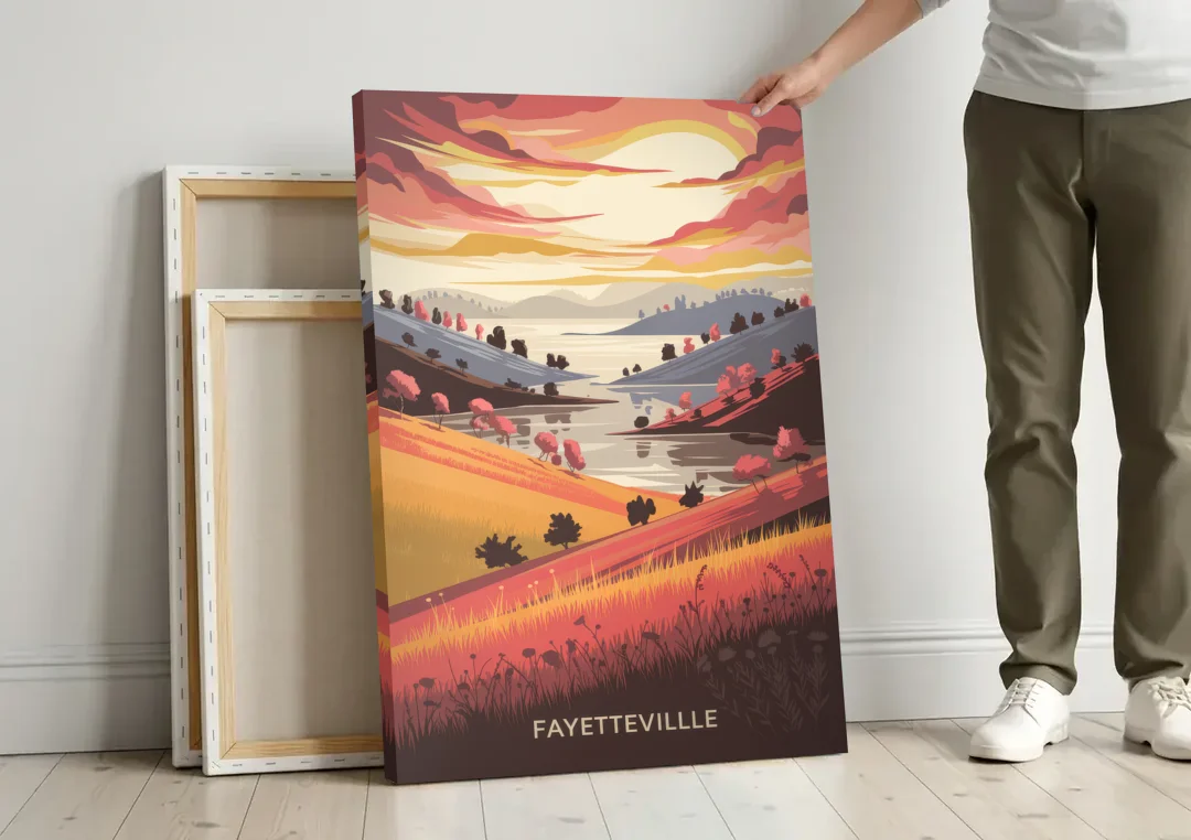 Fayetteville Sunset Views canvas wall art leaning against a wall next to blank canvases