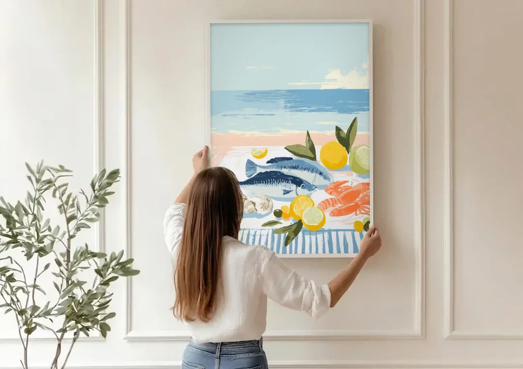 Fish Painting with Lemons by the Sea canvas wall art being hung on a paneled wall