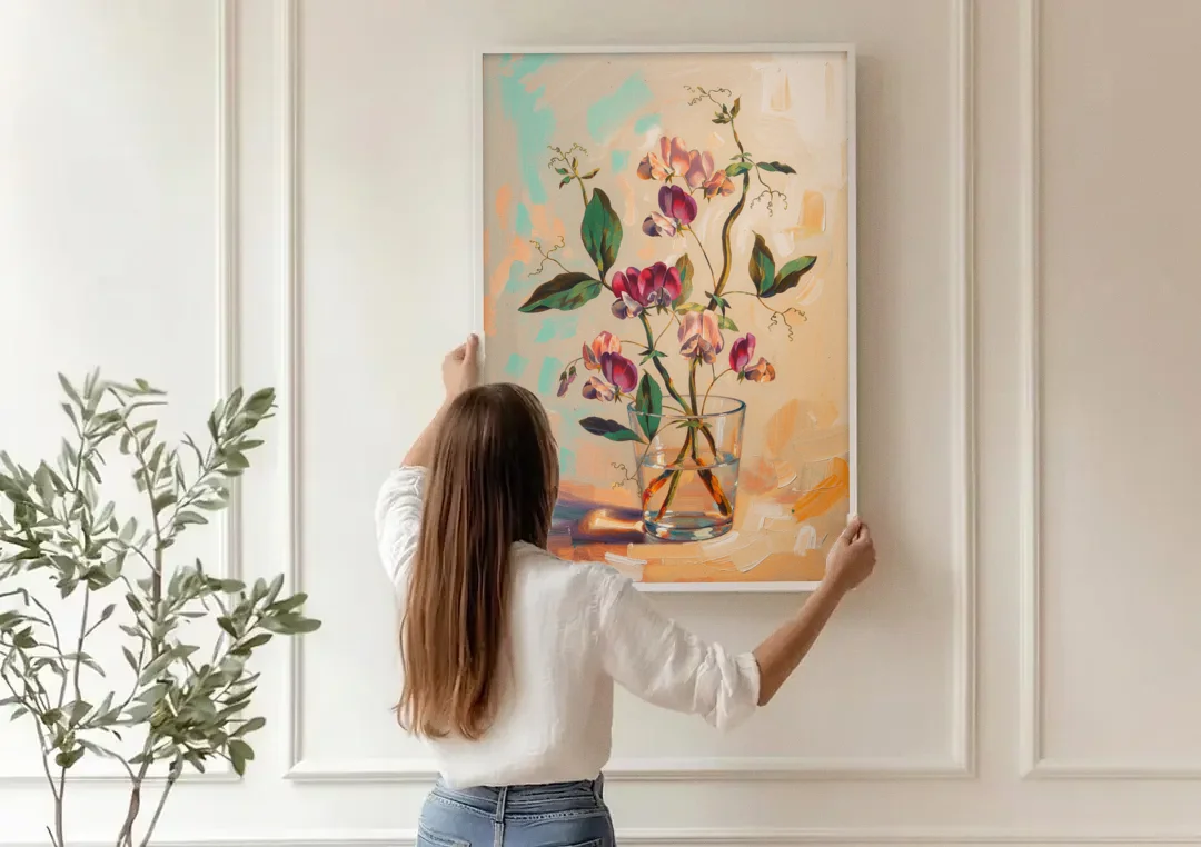 Flower Art Prints Sweet Peas in a Glass canvas wall art being hung on a paneled wall