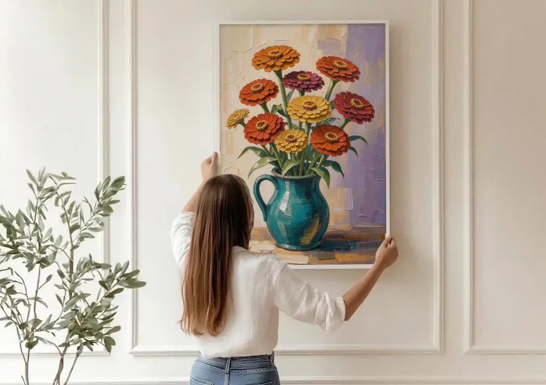 Flower Painting of Zinnias in a Teal Pitcher canvas wall art being hung on a paneled wall