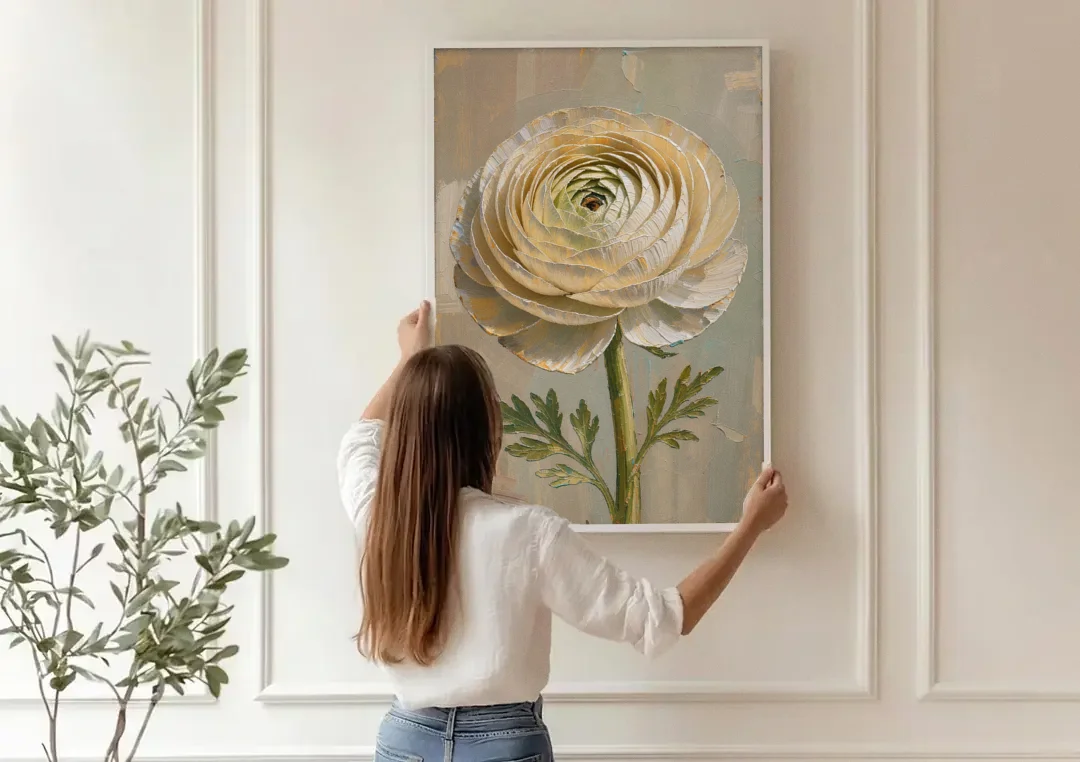 Flower Wall Art with a Cream Ranunculus canvas wall art being hung on a paneled wall