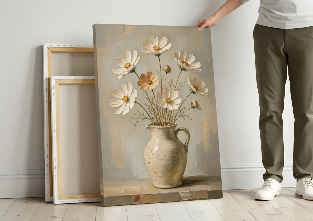 Flowers in Vase Painting with Cosmos and Speckled Jug canvas wall art leaning against a wall next to blank canvases
