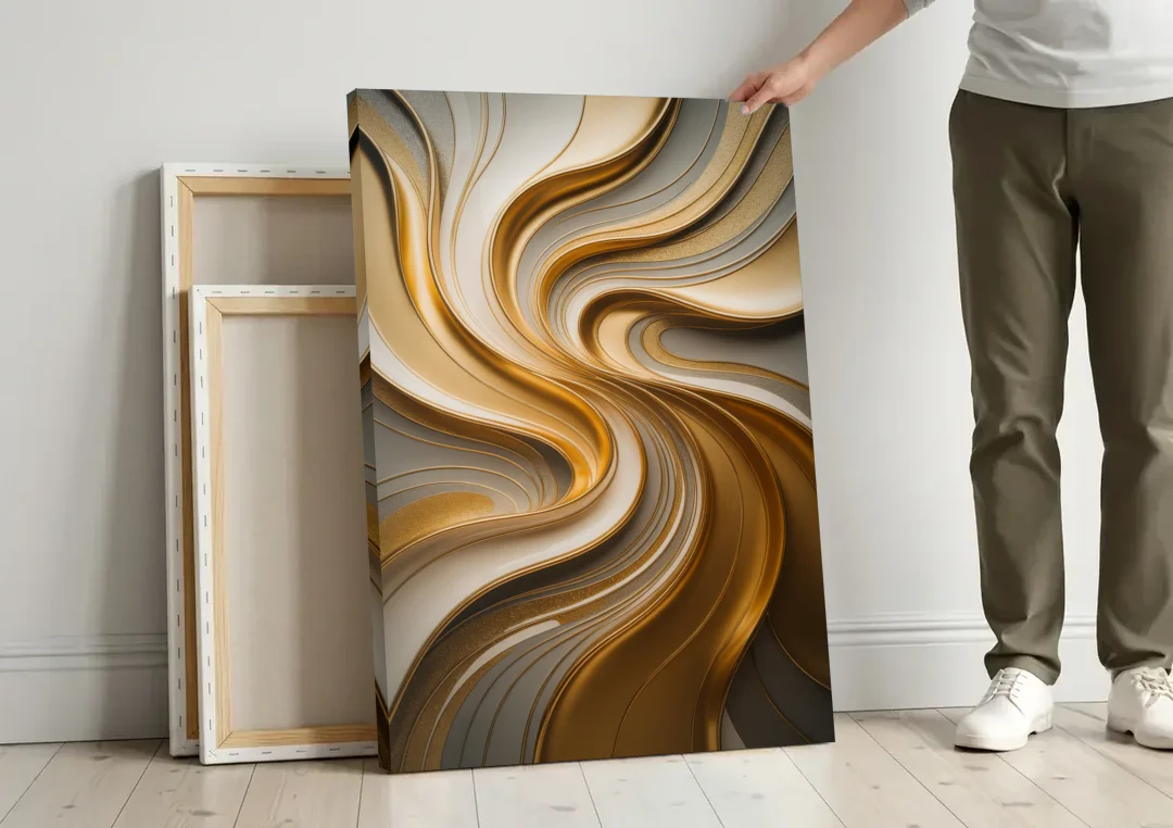 Flowing Rivers in Gold Abstract canvas wall art leaning against a wall next to blank canvases