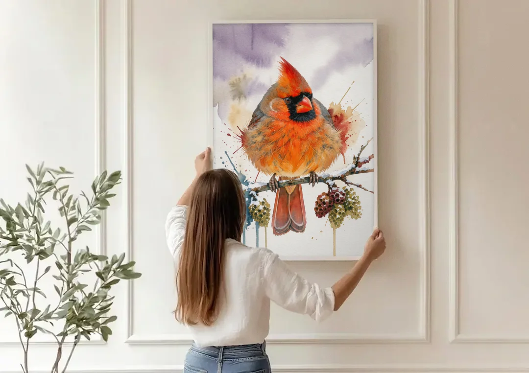 Fluffed Cardinal on a Snowy Alder Twig canvas wall art being hung on a paneled wall