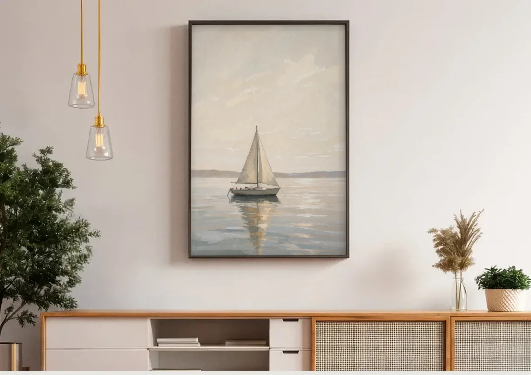 Foyer Wall Art Lone Sailboat on a Glassy Bay canvas wall art above a wooden sideboard under pendant lights