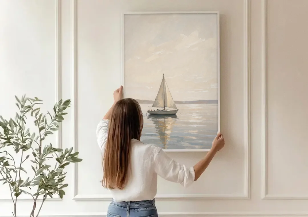 Foyer Wall Art Lone Sailboat on a Glassy Bay canvas wall art being hung on a paneled wall